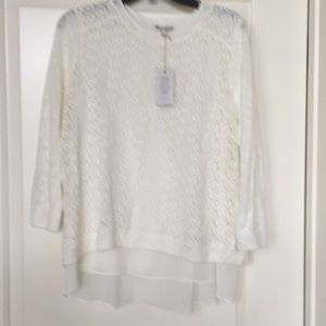 Cream colored 3/4 length sleeve top.